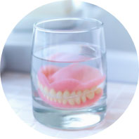 Cup with dentures